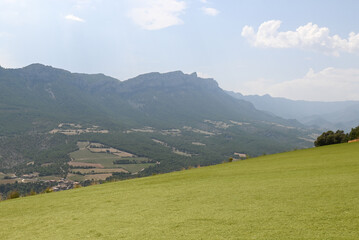 Paragliding instructor with student in the city of Organya in the province of Lleida in northern Spain in August 2025.