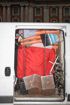 Van with open door charged with Window Mannequin 