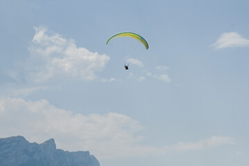 Man paragliding in the town of Organya in the province of Lleida in northern Spain in August 2025.