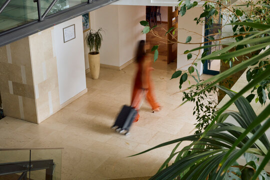 Woman walks through the hotel lobby