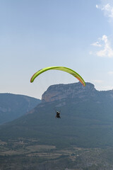 Man paragliding in the town of Organya in the province of Lleida in northern Spain in August 2025.