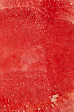The vibrant red flesh of a watermelon showcases its juicy texture