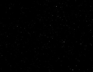 Obraz premium A dark, starry night sky. Tiny white specks scattered