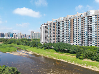 Modern Cityscape with River and Green Spaces