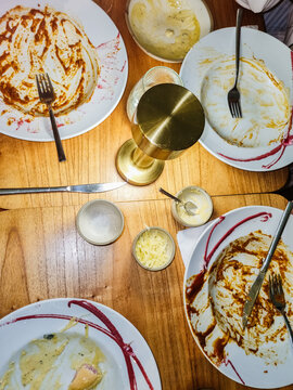 Empty dishes at a restaurant table