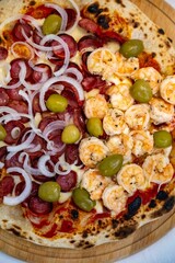 Delicious and irresistible Brazilian pizza, half pepperoni with onion and half shrimp