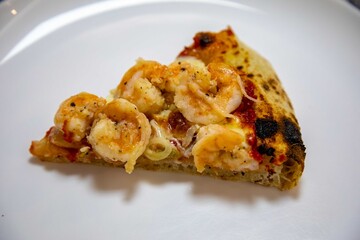 Delicious and irresistible Brazilian pizza, half pepperoni with onion and half shrimp