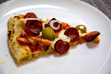 Delicious and irresistible Brazilian pizza, half pepperoni with onion and half shrimp