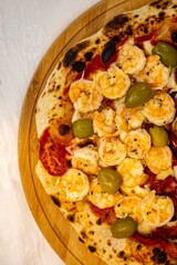 Delicious and irresistible Brazilian pizza, half pepperoni with onion and half shrimp