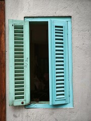 blue window on a white wall