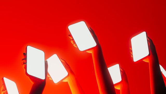 Hands display mobile devices with bright screens in vibrant setting