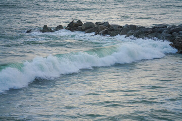 waves breaking on the rocks