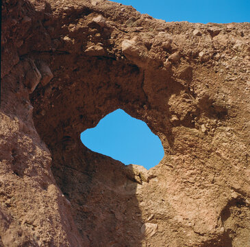 Natural Rock Window in Desert Sunlight
