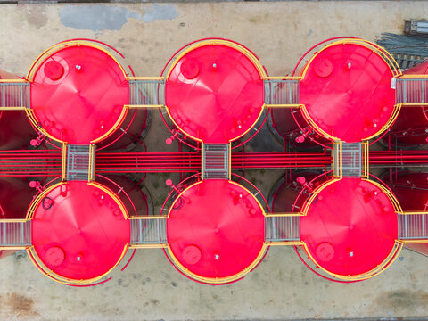 Aerial view of red storage tanks in chemical plant