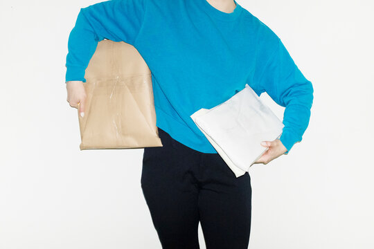 Person holding brown cardboard mail parcel package delivery boxes