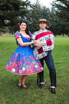 Traditional Cueca Dance Partners in Coordinated Folk Costumes