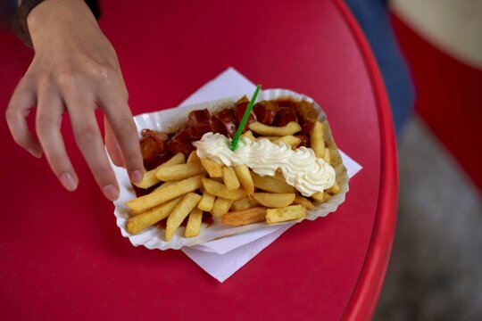 Freshly Served Fries With Ketchup and Mayonnaise on a Vibrant Table