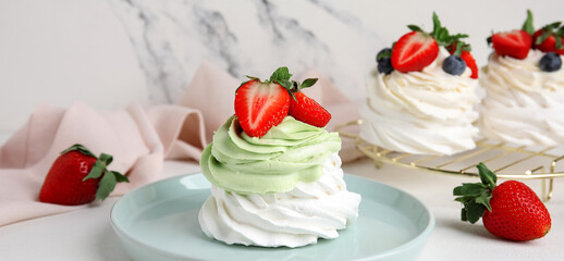 Plate with sweet Pavlova cake on white background