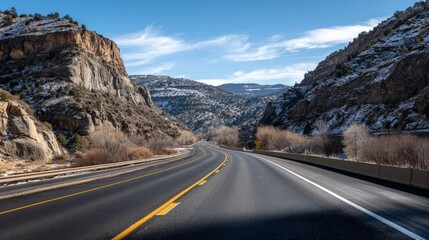 Fototapeta premium Scenic highway winding through a mountain valley.