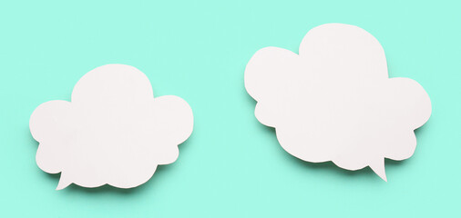 Blank speech bubbles on turquoise background