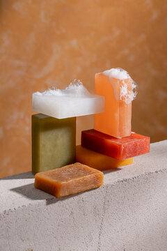 Vibrant soaps stacked with bubbles. Skincare concept for beauty.