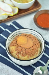 Steamed rice with chicken and egg, served with cracker and chilli,  comfort food for breakfast