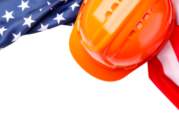 Orange hard hat resting next to American flags, isolated on white, PNG