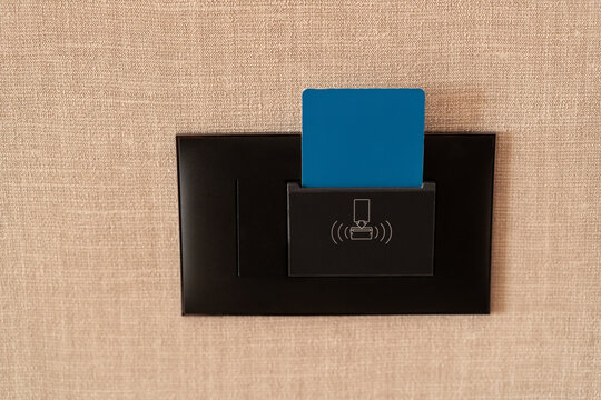 Hotel Room Key Card in a Wall Slot
