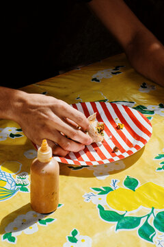 Enjoying a Delicious Meal at an Outdoor Table in Bright Sunlight