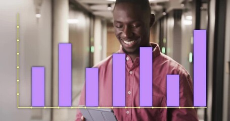 Office worker raising tablet and reviewing business chart showing purple bar growing then shrinking - Powered by Adobe