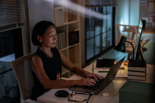 Professional working late to meet deadline
