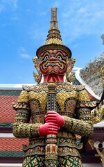 One of the giant door guardians of Wat Phra Sri Rattana Satsadaram (Wat Phra Kaew).His name is“Suriyaphop” he has scarlet face and skin and has a special weapon, the 