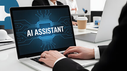 Business professional using AI assistant technology on laptop in modern office setting