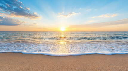 Golden sun setting over calm ocean waves, creating serene atmosphere on beach