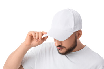 Handsome young man in stylish cap on white background