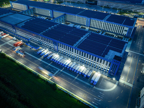 Warehouse and Truck Logistics Aerial View at Night