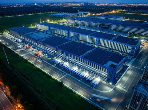 Warehouse and Truck Logistics Aerial View at Night