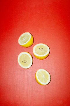 Metal pierced yellow fresh citrus fruit lemons with hard flashlight