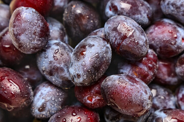 Texture of fresh ripe plums as background