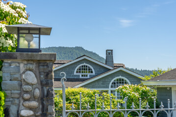 Top of luxury house with shingle roof and nice windows in Summer in Vancouver, Canada, North America. Day time on August 2025.