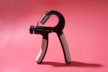 The handgrip is placed on a red background