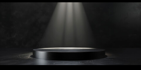 Spotlight illuminates empty circular stage in dark room
