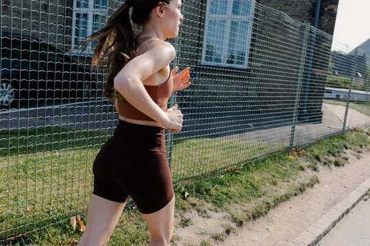 A healthy young woman enjoying a morning jog in Copenhagen