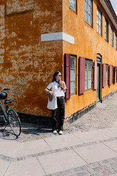 Full body portrait of a tourist in the traditional town of Nyboder