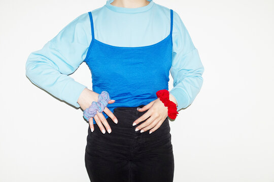Person with fashion colourful hair scrunchies in office and flashlight