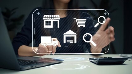 Woman Touches Holographic Interface with E-Commerce Icons at White Table with Laptop and Calculator - Powered by Adobe
