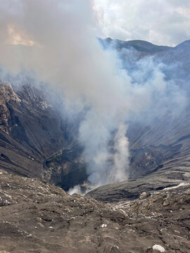 Smoking crater of active volcanic mountain
