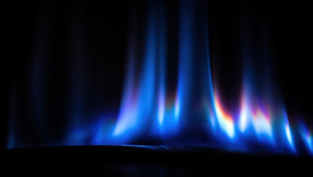 Vibrant blue flames against a dark background