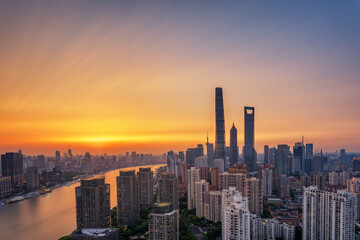 Fototapeta premium Overlooking Shanghai Lujiazui skyscrapers at golden dusk