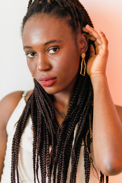 Closeup portrait of confident African American woman with long braids